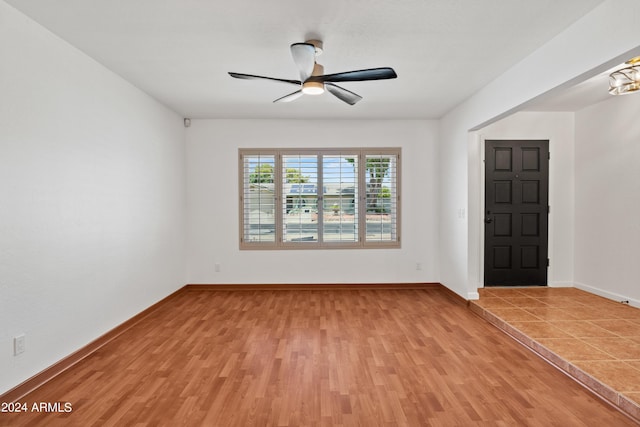 unfurnished room featuring ceiling fan and light hardwood / wood-style floors