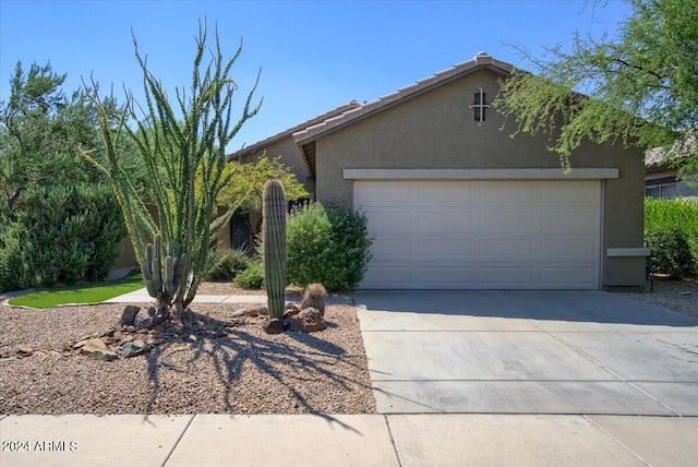 ranch-style house featuring a garage