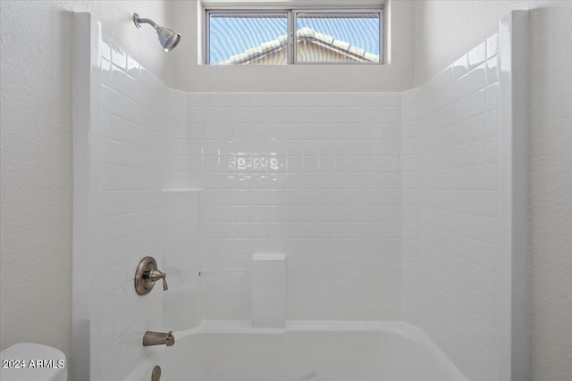 details featuring  shower combination and toilet