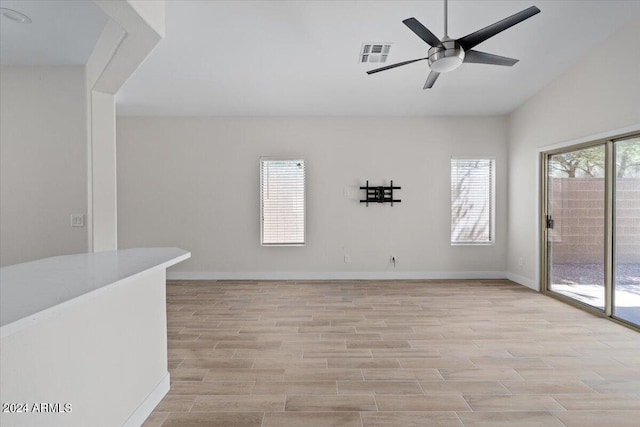 spare room with light hardwood / wood-style flooring and ceiling fan