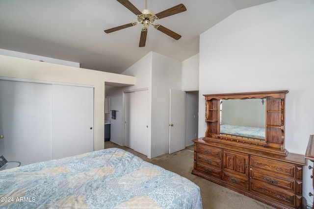 bedroom featuring ceiling fan, light carpet, and vaulted ceiling