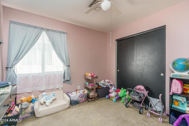 recreation room with ceiling fan and carpet floors