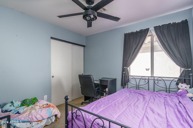 bedroom with carpet floors, a closet, and ceiling fan