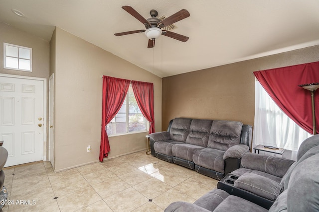 tiled living room featuring ceiling fan and lofted ceiling