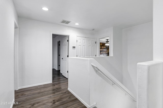 hallway with dark wood-type flooring