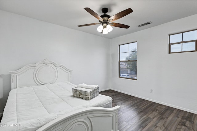 bedroom featuring ceiling fan and dark hardwood / wood-style flooring