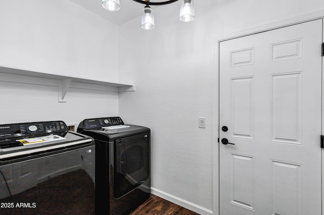 washroom with dark hardwood / wood-style floors and washer and dryer