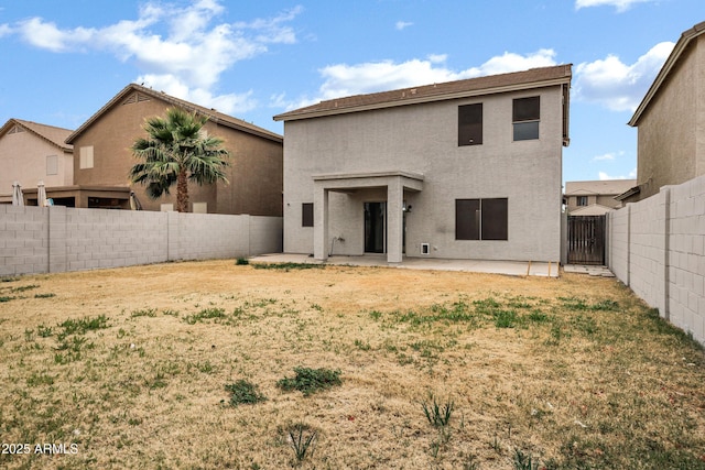 rear view of property featuring a patio area