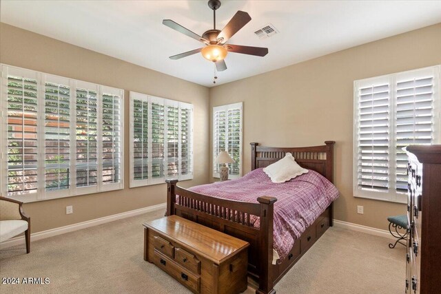 carpeted bedroom with ceiling fan