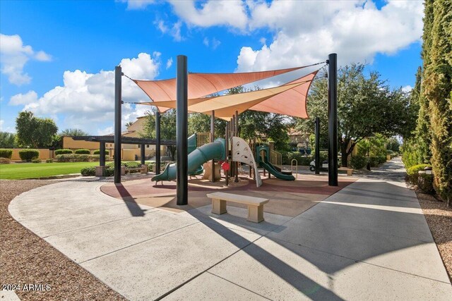 view of playground with a yard