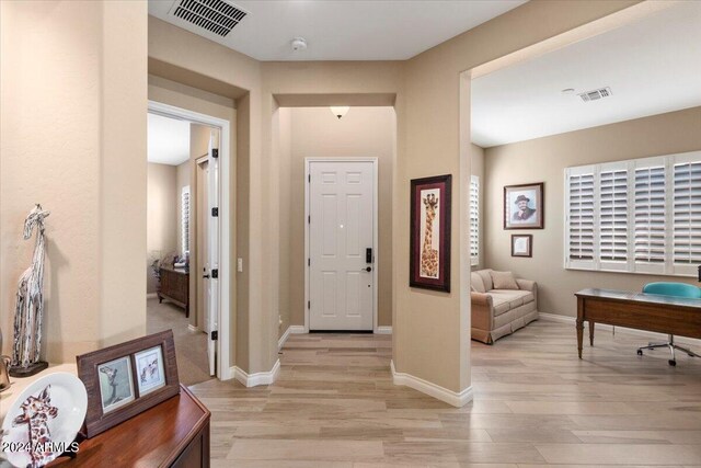 foyer with light hardwood / wood-style floors