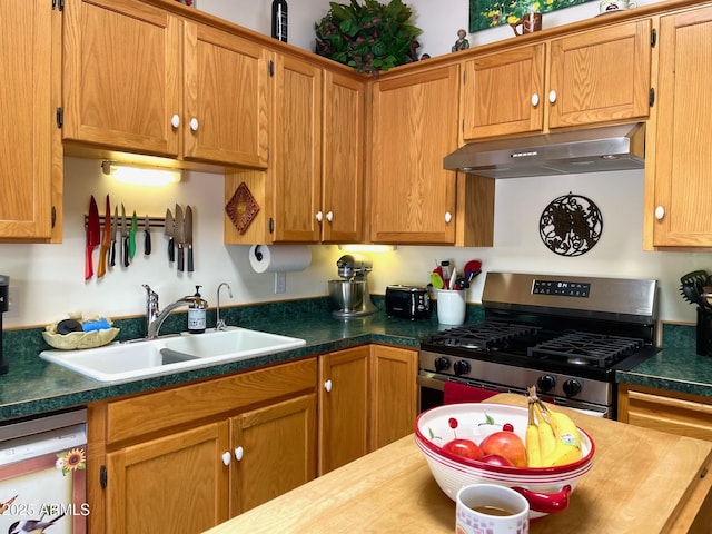 510 Tombstone Cyn, Bisbee, AZ 85603 - kitchen with under cabinet range hood, gas range, a sink, dishwasher, and brown cabinetry