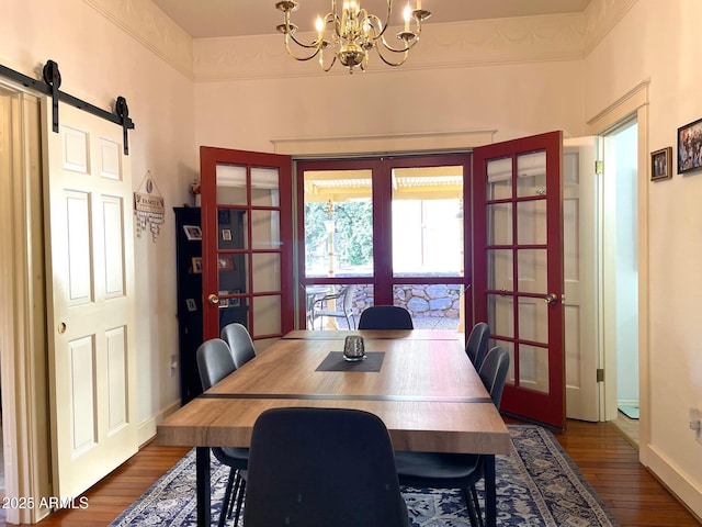 510 Tombstone Cyn, Bisbee, AZ 85603 - dining space with a chandelier, dark wood finished floors, baseboards, and a barn door