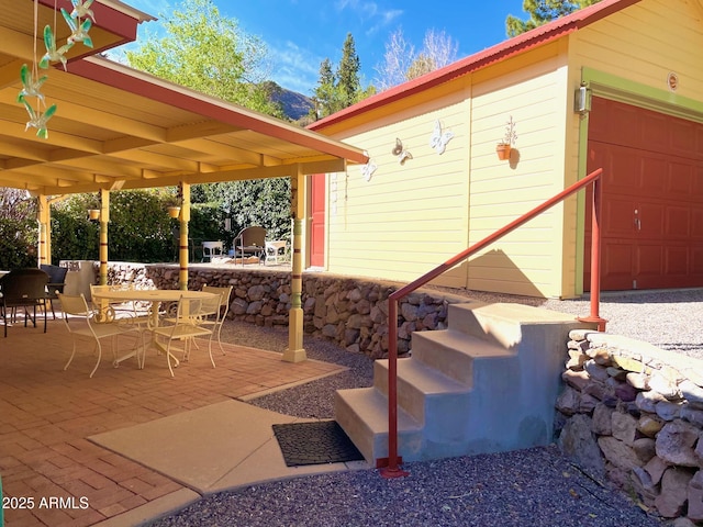 510 Tombstone Cyn, Bisbee, AZ 85603 - view of patio / terrace with outdoor dining area and a garage