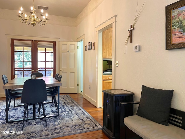 510 Tombstone Cyn, Bisbee, AZ 85603 - dining room featuring wood finished floors, a chandelier, and french doors