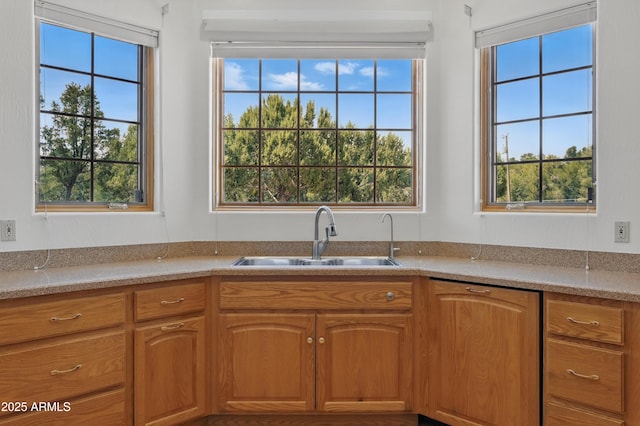 889 E Dealers Choice Ln, Payson, AZ 85541 - kitchen with a sink, light countertops, plenty of natural light, and brown cabinets