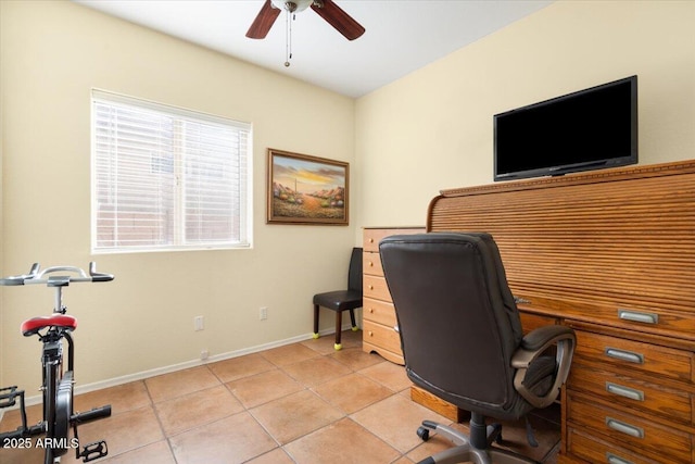 tiled office featuring ceiling fan