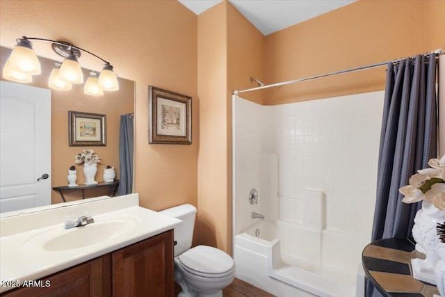 full bathroom featuring vanity, shower / bath combination with curtain, and toilet