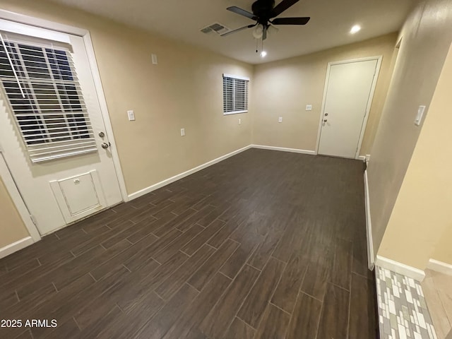 interior space featuring ceiling fan and dark hardwood / wood-style floors