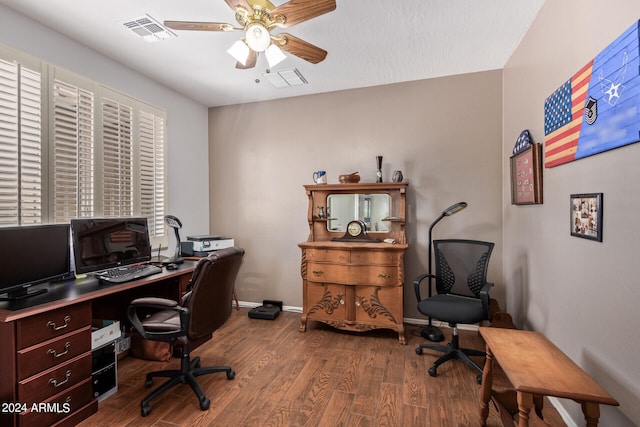 home office with wood-type flooring, a wealth of natural light, and ceiling fan