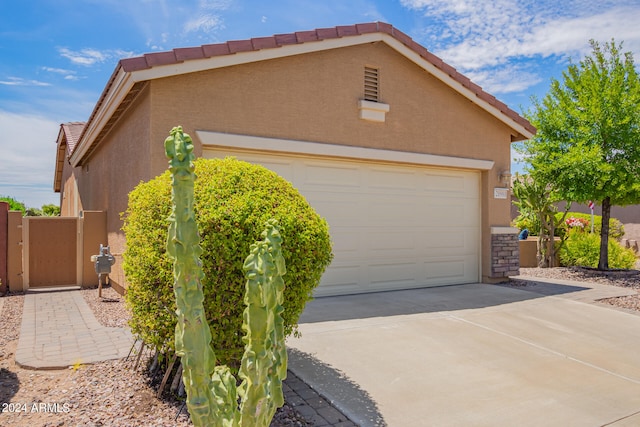 view of side of property featuring a garage