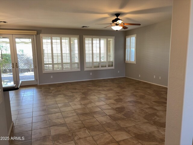 tiled living room with ceiling fan