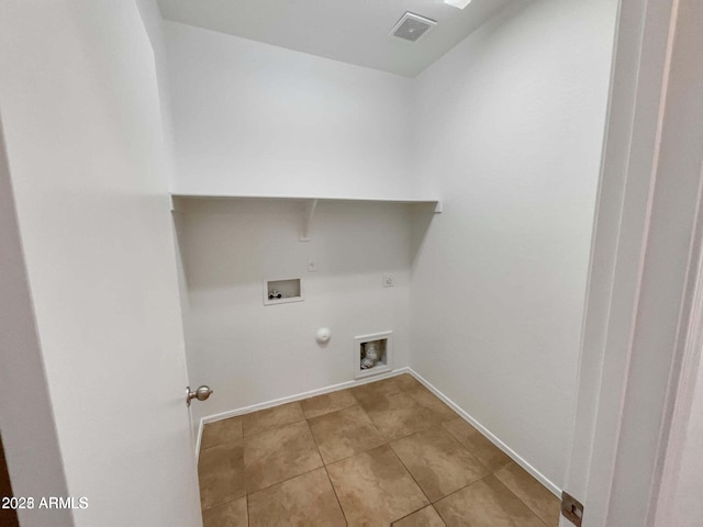5339 W Maldonado Rd, Laveen, AZ 85339 - laundry room with gas dryer hookup, hookup for a washing machine, light tile patterned flooring, hookup for an electric dryer, and baseboards