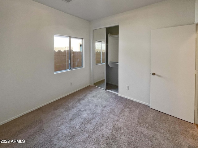 5339 W Maldonado Rd, Laveen, AZ 85339 - unfurnished bedroom featuring carpet, a closet, and baseboards