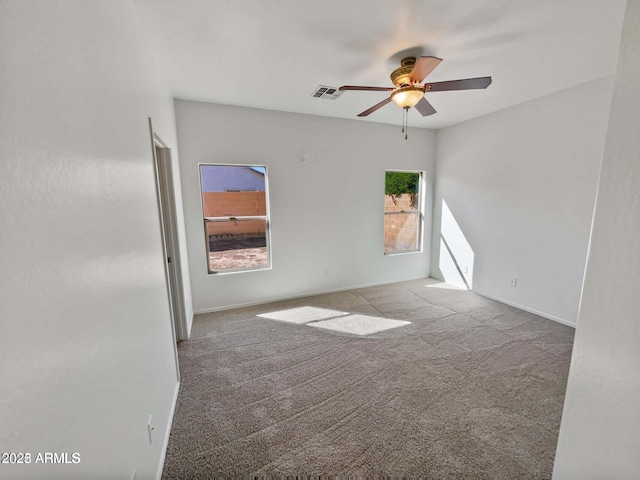 5339 W Maldonado Rd, Laveen, AZ 85339 - carpeted spare room with a ceiling fan