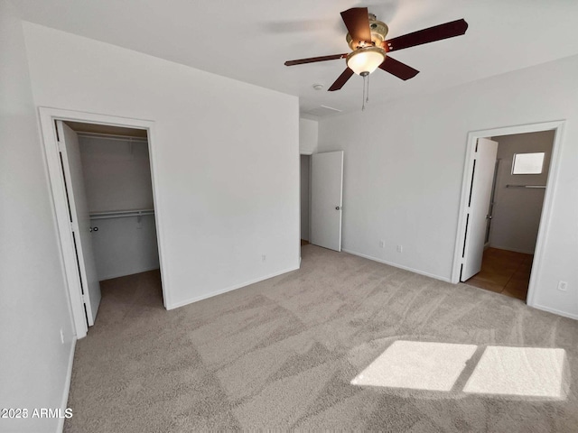 5339 W Maldonado Rd, Laveen, AZ 85339 - unfurnished bedroom featuring carpet flooring, a spacious closet, ensuite bath, baseboards, and a closet