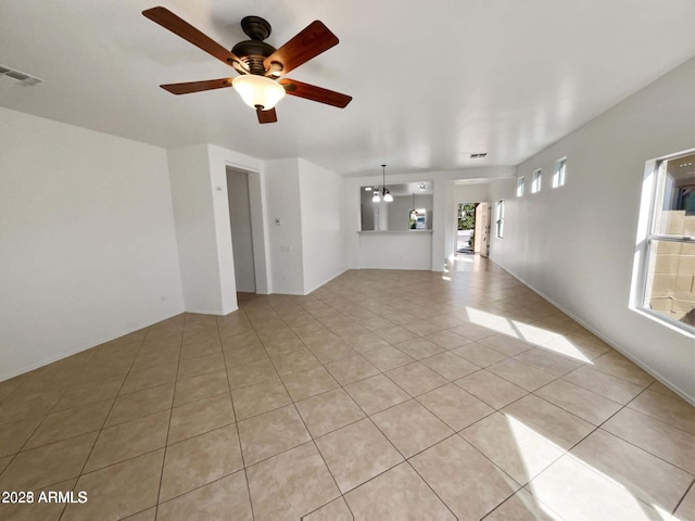 5339 W Maldonado Rd, Laveen, AZ 85339 - empty room with light tile patterned floors and a ceiling fan