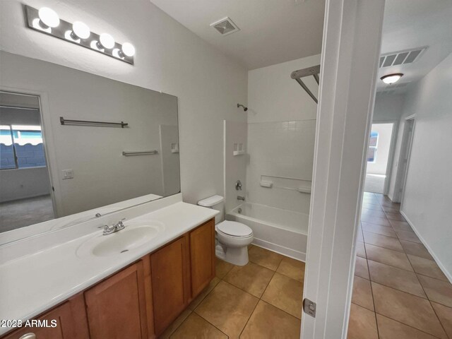 5339 W Maldonado Rd, Laveen, AZ 85339 - full bath featuring vanity, toilet, tile patterned flooring, and tub / shower combination