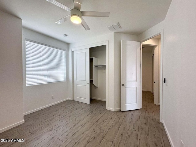 30507 N 167th St, Scottsdale, AZ 85262 - unfurnished bedroom with light wood finished floors, a closet, baseboards, and a ceiling fan