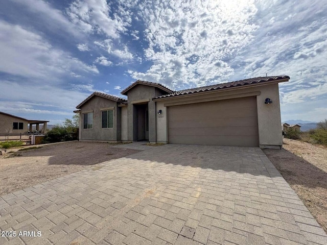 30507 N 167th St, Scottsdale, AZ 85262 - ranch-style house with stucco siding, an attached garage, decorative driveway, and a tiled roof