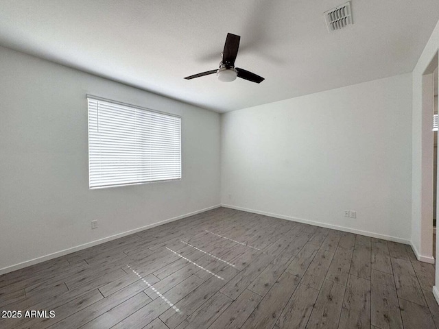 30507 N 167th St, Scottsdale, AZ 85262 - spare room with dark wood-type flooring, ceiling fan, and baseboards
