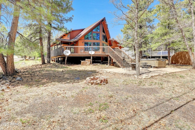 17425 Sequoia Dr, Munds Park, AZ 86017 - rear view of property featuring a hot tub, a deck, stairs, a patio, and fence