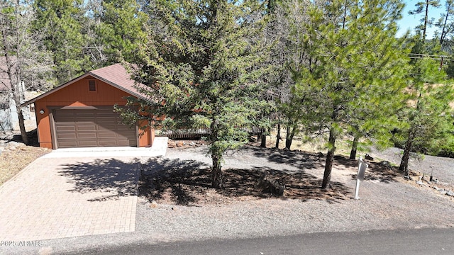 17425 Sequoia Dr, Munds Park, AZ 86017 - obstructed view of property with driveway and an outbuilding