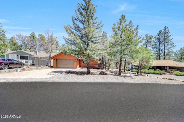 17425 Sequoia Dr, Munds Park, AZ 86017 - view of front of home featuring an attached garage and driveway