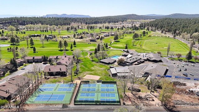 17425 Sequoia Dr, Munds Park, AZ 86017 - bird's eye view of a heavily wooded area, a mountainous background, and a local golf course