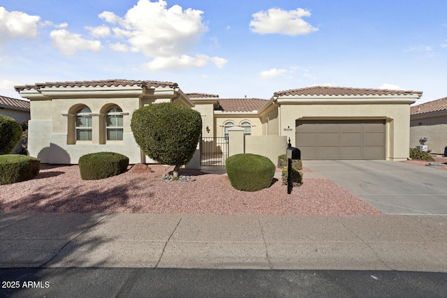 mediterranean / spanish-style house featuring a garage