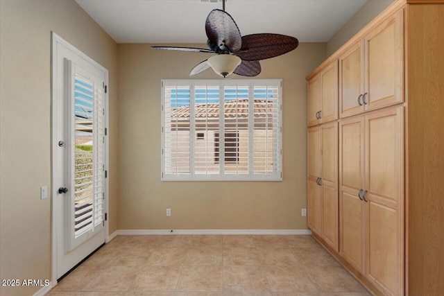 interior space featuring ceiling fan