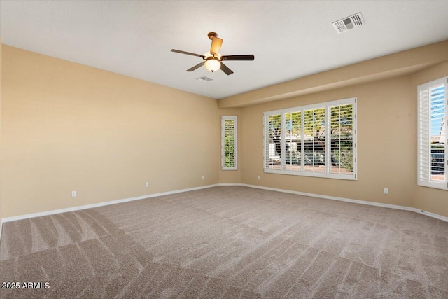 unfurnished room with ceiling fan and carpet flooring