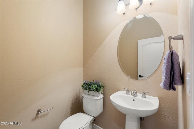 bathroom with sink and toilet