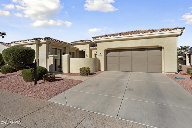 mediterranean / spanish-style home with a garage