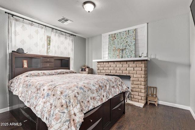 bedroom with dark hardwood / wood-style flooring