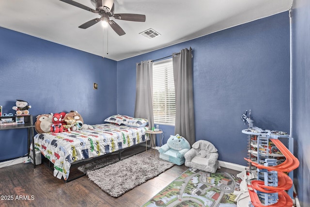 bedroom with hardwood / wood-style floors and ceiling fan