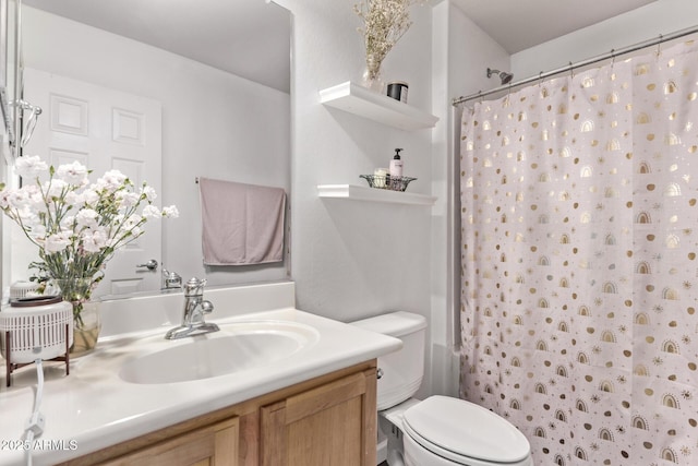 bathroom featuring vanity, curtained shower, and toilet