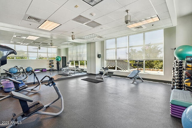 exercise room with a drop ceiling