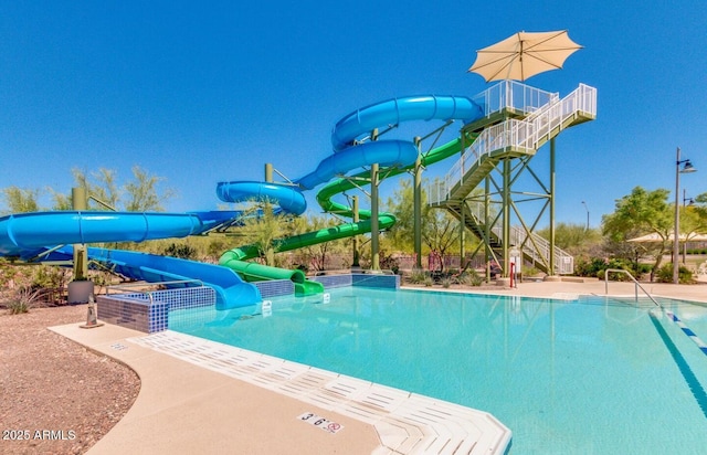 view of pool featuring a water slide