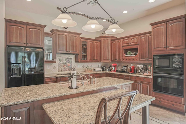 kitchen with visible vents, glass insert cabinets, hanging light fixtures, black appliances, and backsplash